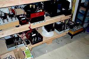The lower two shelves with Stealth conditioners and various tube amps